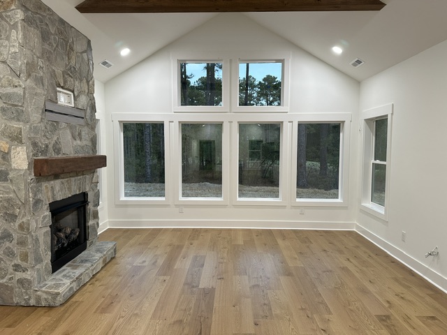 living room with a fireplace after a post-construction cleaning